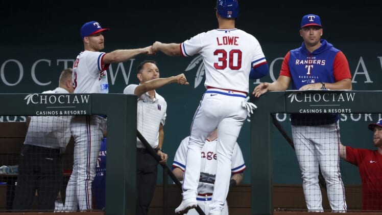 Aug 13, 2022; Arlington, Texas, USA;  Texas Rangers first baseman Nathaniel Lowe (30) celebrates with teammates after scoring during the fourth inning against the Seattle Mariners at Globe Life Field. Mandatory Credit: Kevin Jairaj-USA TODAY Sports