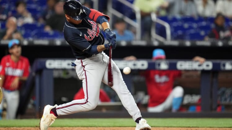 Aug 13, 2022; Miami, Florida, USA; Atlanta Braves shortstop Vaughn Grissom (18) hits a two-run home run in the fifth inning against the Miami Marlins at loanDepot Park. Mandatory Credit: Jim Rassol-USA TODAY Sports