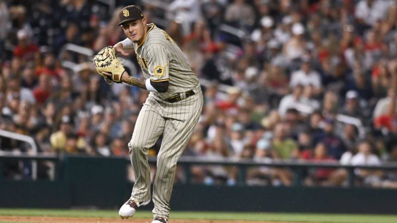 Aug 13, 2022; Washington, District of Columbia, USA; San Diego Padres third baseman Manny Machado (13) looks to throw to first base during the eighth inning against the Washington Nationals  at Nationals Park. Mandatory Credit: Tommy Gilligan-USA TODAY Sports