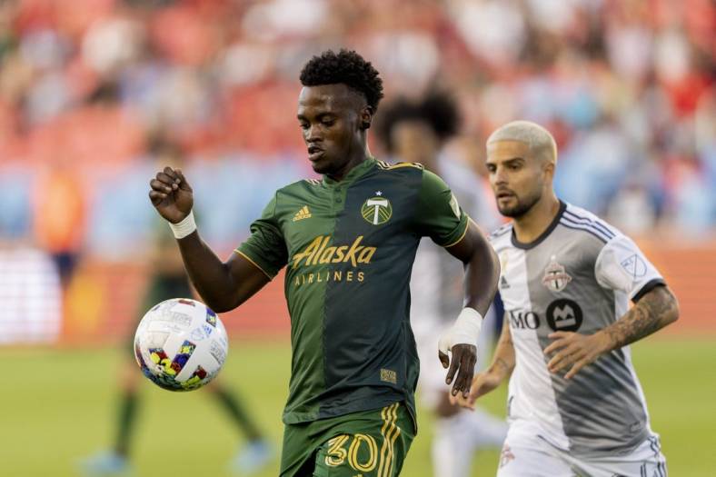 Aug 13, 2022; Toronto, Ontario, CAN; Portland Timbers midfielder Santiago Moreno (30) moves the ball against Toronto FC during the first half at BMO Field. Mandatory Credit: Kevin Sousa-USA TODAY Sports