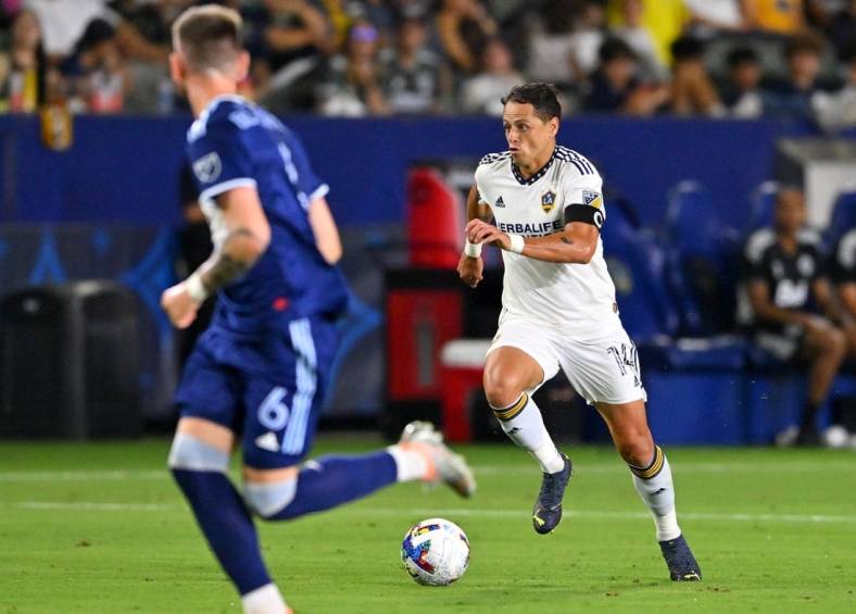 Aug 13, 2022; Carson, California, USA;   Los Angeles Galaxy forward Javier Hern  ndez (14) as he takes the ball down field in the second half against the Vancouver Whitecaps at Dignity Health Sports Park. Mandatory Credit: Jayne Kamin-Oncea-USA TODAY Sports