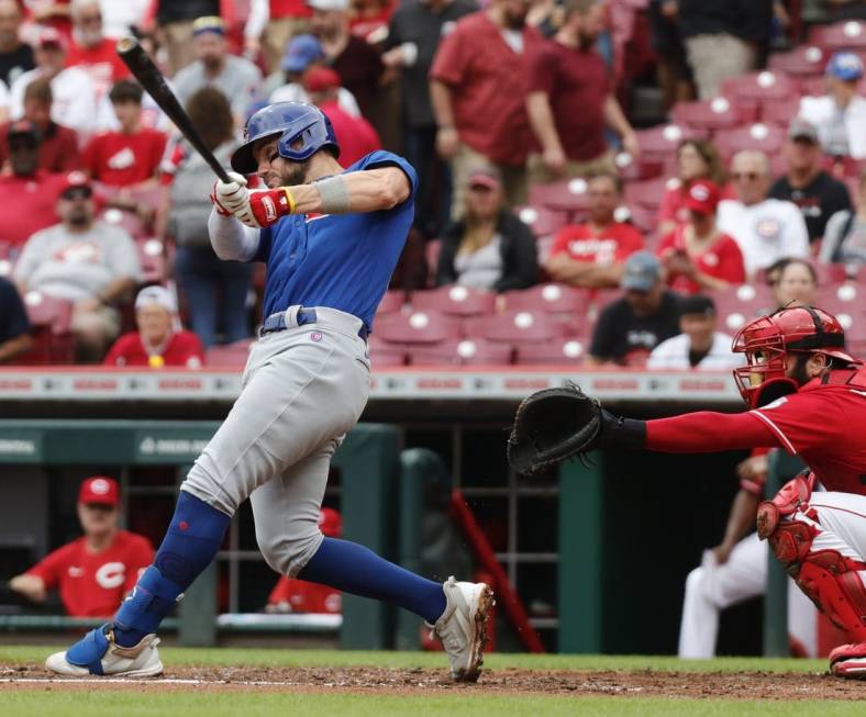 Aug 14, 2022; Cincinnati, Ohio, USA; Chicago Cubs first baseman Patrick Wisdom (16) hits a two-run home run against the Cincinnati Reds during the second inning at Great American Ball Park. Mandatory Credit: David Kohl-USA TODAY Sports