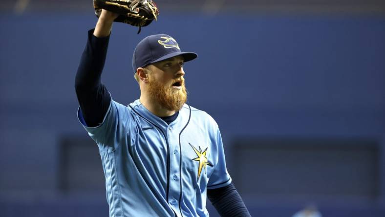 Aug 14, 2022; St. Petersburg, Florida, USA; Tampa Bay Rays starting pitcher Drew Rasmussen (57) walks back to the dugout against the Baltimore Orioles at the end of the sixth inning at Tropicana Field. Mandatory Credit: Kim Klement-USA TODAY Sports