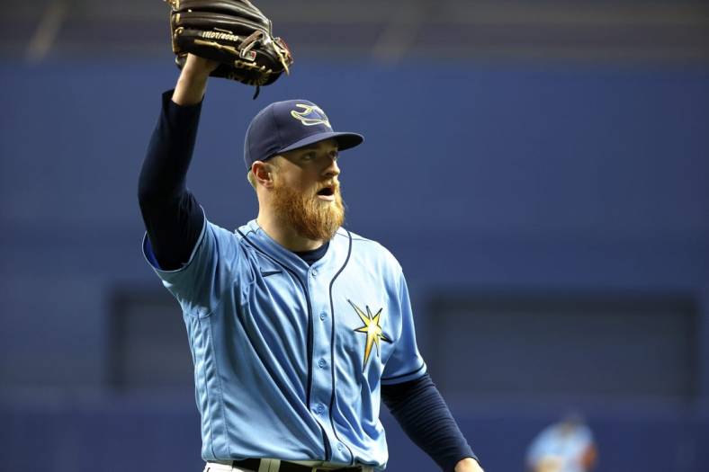 Aug 14, 2022; St. Petersburg, Florida, USA; Tampa Bay Rays starting pitcher Drew Rasmussen (57) walks back to the dugout against the Baltimore Orioles at the end of the sixth inning at Tropicana Field. Mandatory Credit: Kim Klement-USA TODAY Sports
