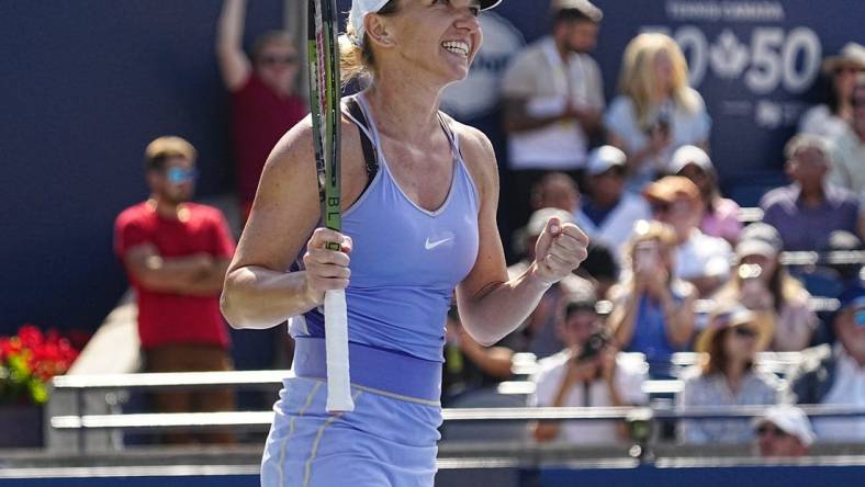 Aug 14, 2022; Toronto, ON, Canada; Simona Halep (ROU) celebrates defeating Beatriz Haddad Maia (not pictured)  in the women's final of the National Bank Open at Sobeys Stadium. Mandatory Credit: John E. Sokolowski-USA TODAY Sports