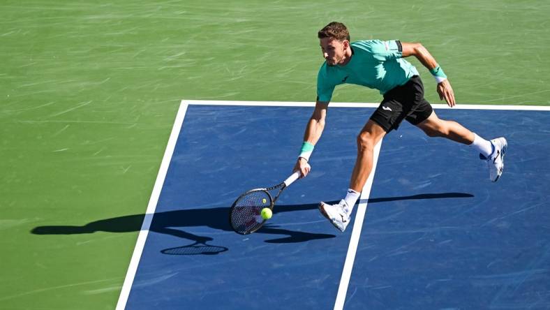 Aug 14, 2022; Montreal, QC, Canada; Pablo Carreno Busta (ESP) hits a shot against Hubert Hurkacz (POL) (not pictured) in the singles final match during during the National Bank Open at IGA Stadium. Mandatory Credit: David Kirouac-USA TODAY Sports