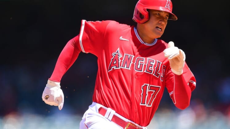 Aug 14, 2022; Anaheim, California, USA; Los Angeles Angels designated hitter Shohei Ohtani (17) runs home to score against the Minnesota Twins during the third inning at Angel Stadium. Mandatory Credit: Gary A. Vasquez-USA TODAY Sports
