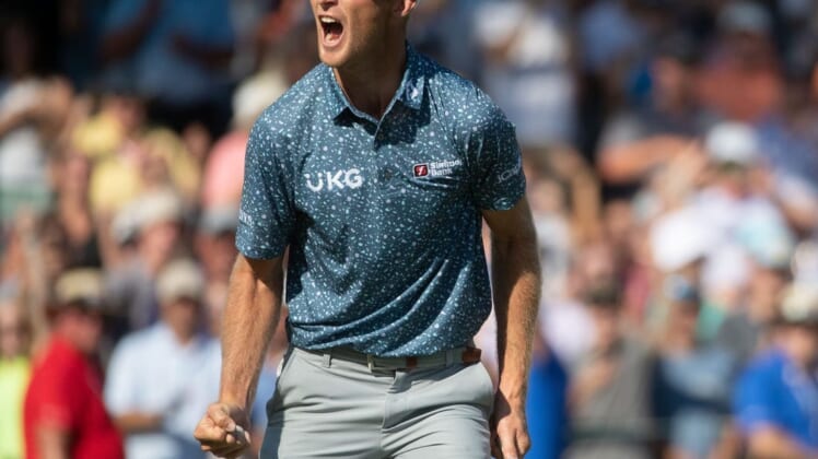 Will Zalatoris reacts after making a par putt on No. 18 during the final round of the FedEx St. Jude Championship on Sunday, Aug. 14, 2022, at TPC Southwind in Memphis.