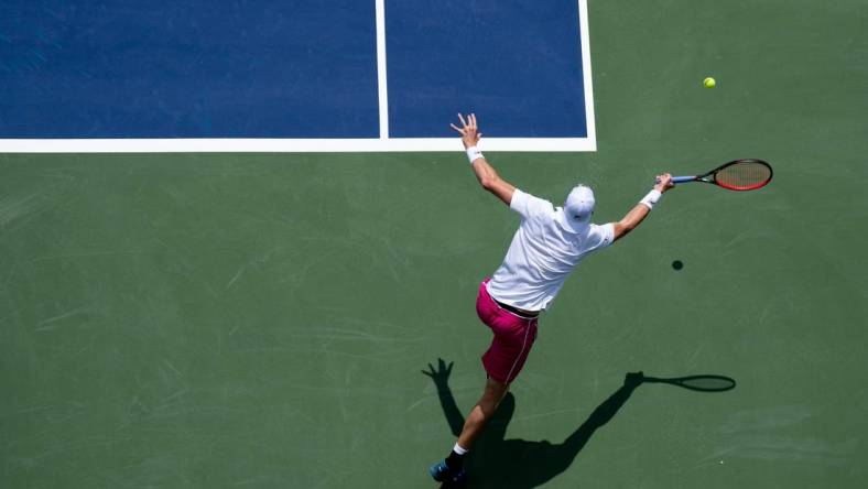 John Isner returns to Benjamin Bonzi during the Western & Southern Open at the Lindner Family Tennis Center in Mason, Ohio Monday, Aug. 15, 2022.

Western Southern Open Day Two Morning 68