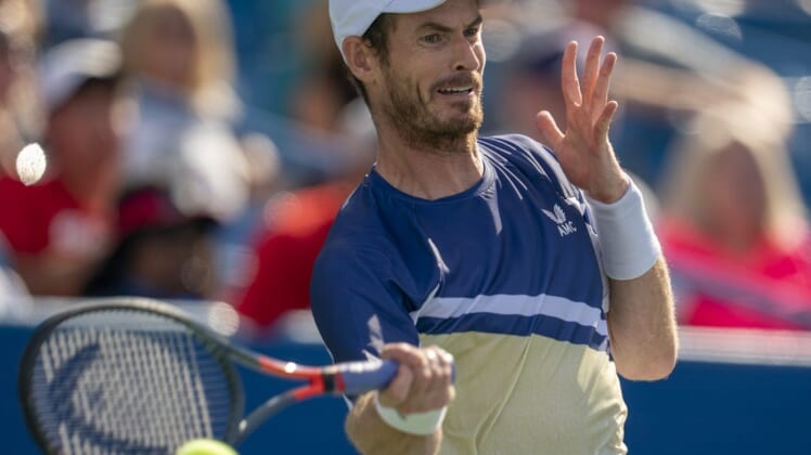 Aug 15, 2022; Cincinnati, OH, USA;  Andy Murray (GBR) returns a shot during his match against Stanislas Wawrinka (SUI) at the Western & Southern at the at the Lindner Family Tennis Center. Mandatory Credit: Susan Mullane-USA TODAY Sports
