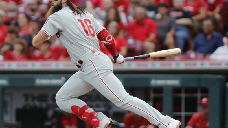 Aug 15, 2022; Cincinnati, Ohio, USA; Philadelphia Phillies center fielder Brandon Marsh (16) hits a single against the Cincinnati Reds during the second inning at Great American Ball Park. Mandatory Credit: David Kohl-USA TODAY Sports