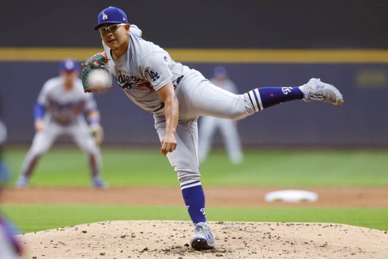 Aug 15, 2022; Milwaukee, Wisconsin, USA;  Los Angeles Dodgers pitcher Julio Urias (7) throws a pitch during the first inning against the Milwaukee Brewers at American Family Field. Mandatory Credit: Jeff Hanisch-USA TODAY Sports