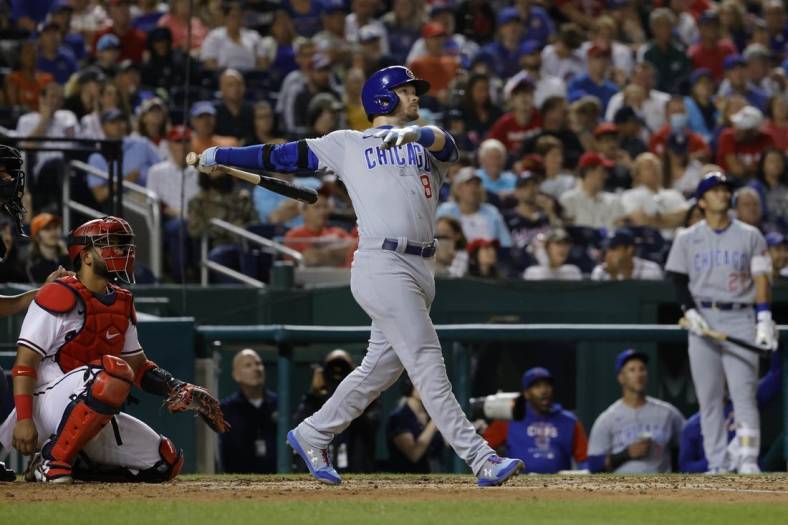 Aug 15, 2022; Washington, District of Columbia, USA; Chicago Cubs left fielder Ian Happ (8) hits a home run against the Washington Nationals during the fifth inning at Nationals Park. Mandatory Credit: Geoff Burke-USA TODAY Sports