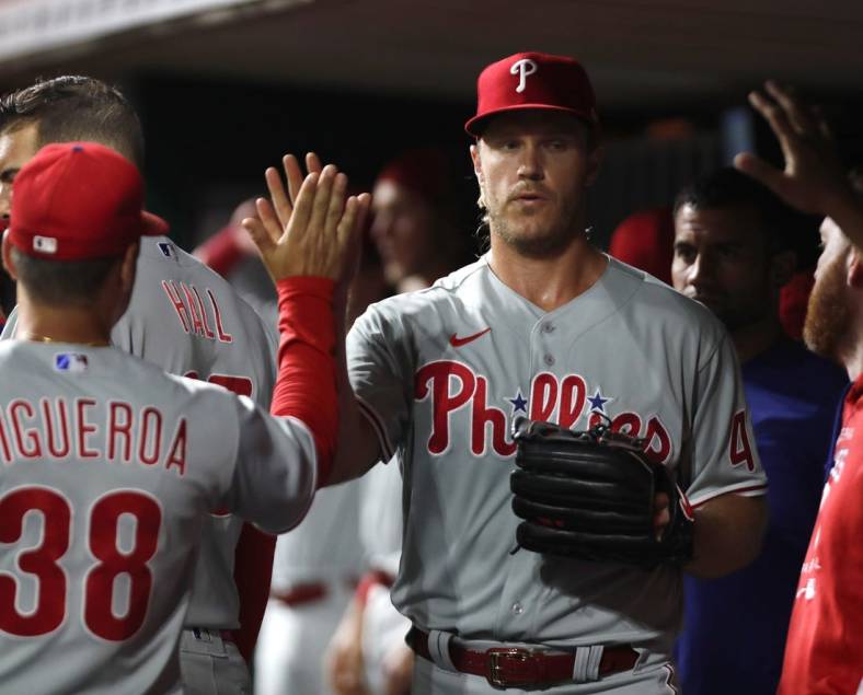 Aug 15, 2022; Cincinnati, Ohio, USA; Philadelphia Phillies starting pitcher Noah Syndergaard (43) reacts with teammates in the dugout after leaving the game in the eighth inning at Great American Ball Park. Mandatory Credit: David Kohl-USA TODAY Sports