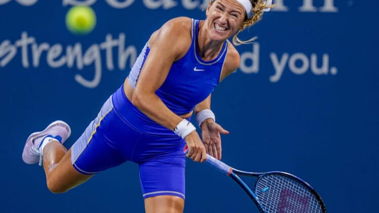 Victoria Azarenka makes a hit to Kaia Kanepi on Grand Stand court during the Western & Southern Open at the Lindner Family Tennis Center in Mason Monday, August 15, 2022.  Azarenka won 6-3, 4-6, 6-3.Monday Tennis10