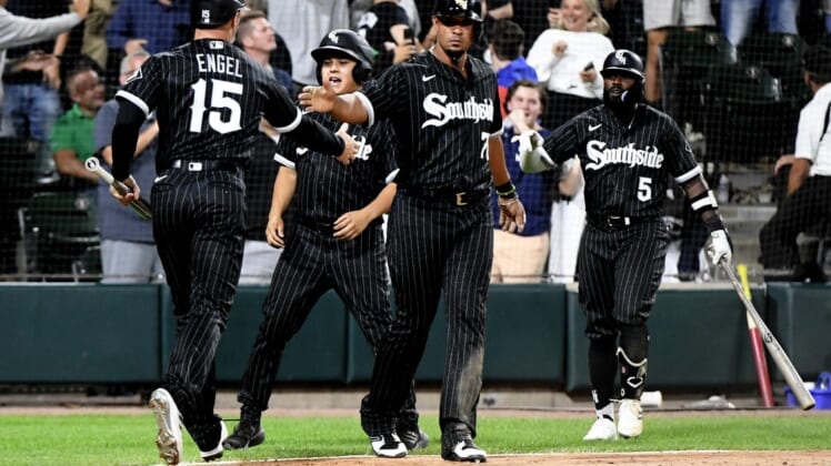 Aug 15, 2022; Chicago, Illinois, USA;  Chicago White Sox first baseman Jose Abreu (79) high fives Chicago White Sox center fielder Adam Engel (15)after they score against the Houston Astros during the eighth inning at Guaranteed Rate Field. Mandatory Credit: Matt Marton-USA TODAY Sports