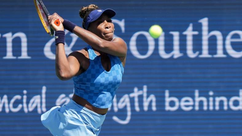 Venus Williams returns the ball during her match against Karolina Pliskova on Center Court during the 2022 Western and Southern Open on Tuesday August 16. Pliskova won the match against Williams.