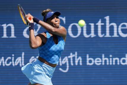 Venus Williams returns the ball during her match against Karolina Pliskova on Center Court during the 2022 Western and Southern Open on Tuesday August 16. Pliskova won the match against Williams.