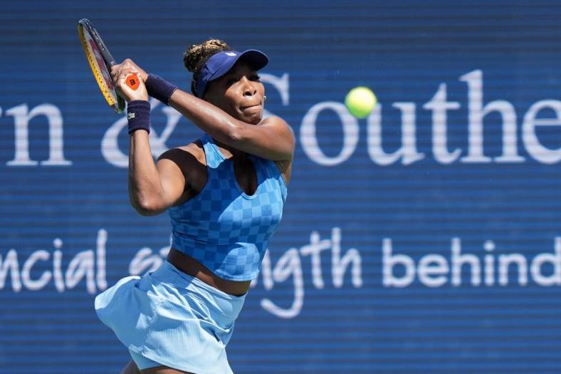 Venus Williams returns the ball during her match against Karolina Pliskova on Center Court during the 2022 Western and Southern Open on Tuesday August 16. Pliskova won the match against Williams.