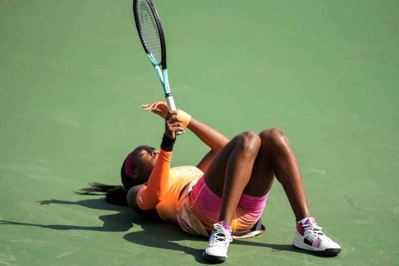 Coco Gauff falls after rushing to get the ball during her match against Marle Bouzkova on the Grand Stand court at the 2022 Western & Southern Open on Tuesday August 16. Gauff forfeit during the second set after receiving an injury.