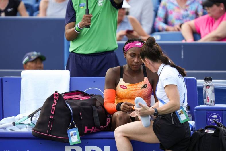 Coco Gauff is tended to between games after falling during her match against Marle Bouzkova.

Syndication The Enquirer