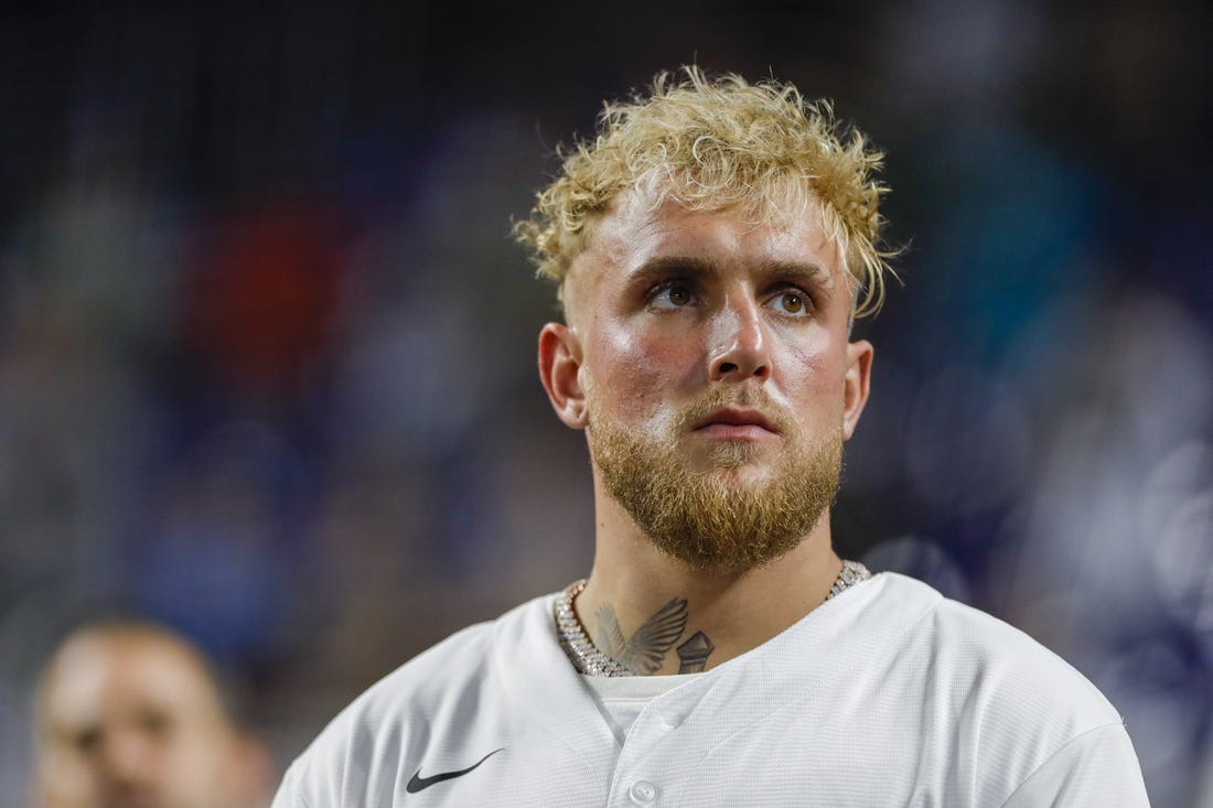 Aug 16, 2022; Miami, Florida, USA; YouTube personality and boxer Jake Paul listens to the national anthem prior to the game between the Miami Marlins and the San Diego Padres at loanDepot Park. Mandatory Credit: Sam Navarro-USA TODAY Sports