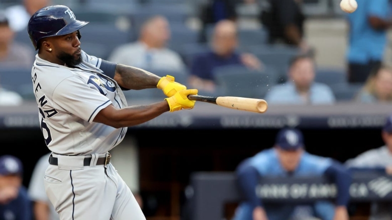 Aug 16, 2022; Bronx, New York, USA; Tampa Bay Rays right fielder Randy Arozarena (56) hits a three run home run against the New York Yankees during the first inning at Yankee Stadium. Mandatory Credit: Brad Penner-USA TODAY Sports