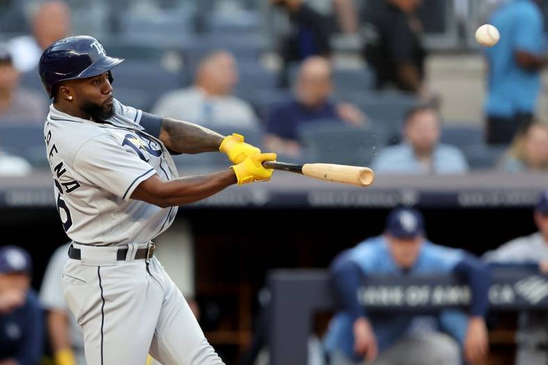 Aug 16, 2022; Bronx, New York, USA; Tampa Bay Rays right fielder Randy Arozarena (56) hits a three run home run against the New York Yankees during the first inning at Yankee Stadium. Mandatory Credit: Brad Penner-USA TODAY Sports