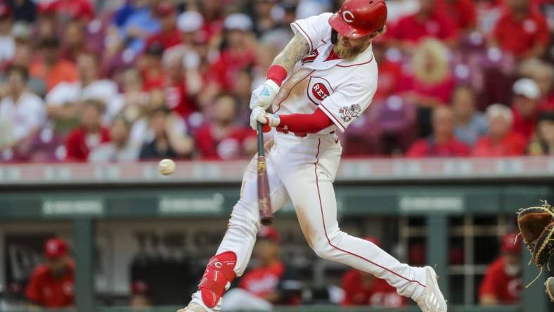 Aug 16, 2022; Cincinnati, Ohio, USA; Cincinnati Reds designated hitter Jake Fraley (27) hits a two-run home run in the third inning against against the Philadelphia Phillies at Great American Ball Park. Mandatory Credit: Katie Stratman-USA TODAY Sports