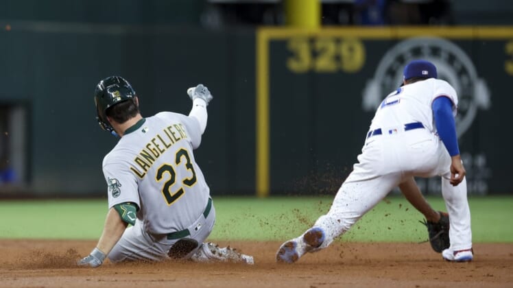 Aug 16, 2022; Arlington, Texas, USA;  Oakland Athletics catcher Shea Langeliers (23) hits a double for his first major league hit during the second inning against the Texas Rangers at Globe Life Field. Mandatory Credit: Kevin Jairaj-USA TODAY Sports