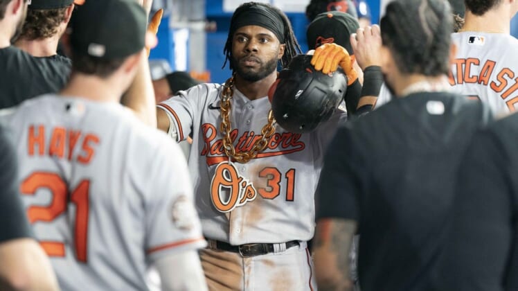 Aug 16, 2022; Toronto, Ontario, CAN; Baltimore Orioles center fielder Cedric Mullins (31) celebrates in the dugout after hitting a home run against the Toronto Blue Jays during the fifth inning at Rogers Centre. Mandatory Credit: Nick Turchiaro-USA TODAY Sports