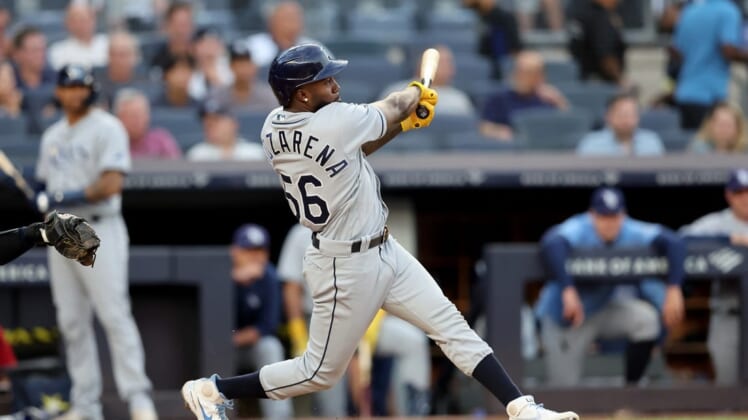 Aug 16, 2022; Bronx, New York, USA; Tampa Bay Rays right fielder Randy Arozarena (56) follows through on a three run home run against the New York Yankees during the first inning at Yankee Stadium. Mandatory Credit: Brad Penner-USA TODAY Sports
