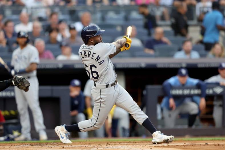 Aug 16, 2022; Bronx, New York, USA; Tampa Bay Rays right fielder Randy Arozarena (56) follows through on a three run home run against the New York Yankees during the first inning at Yankee Stadium. Mandatory Credit: Brad Penner-USA TODAY Sports