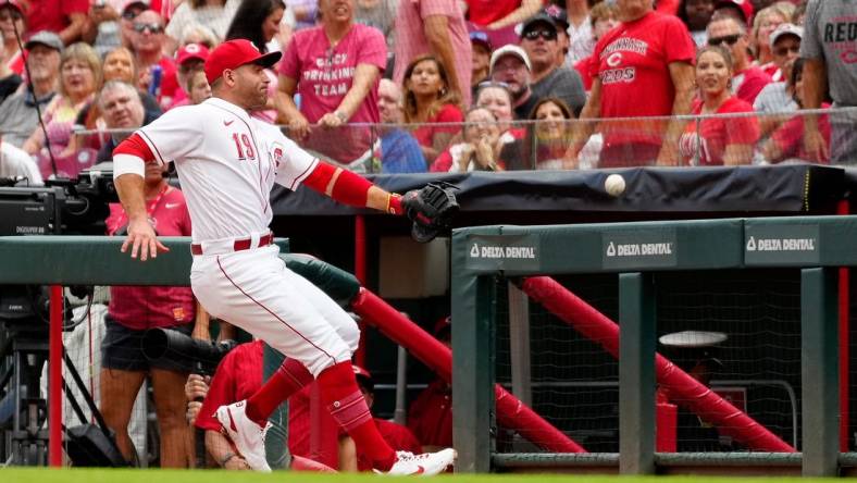 Cincinnati Reds first baseman Joey Votto (19) chases a ball into foul territory in the second inning of the MLB National League game between the Cincinnati Reds and the Philadelphia Phillies at Great American Ball Park in downtown Cincinnati on Tuesday, Aug. 16, 2022.

Philadelphia Phillies At Cincinnati Reds