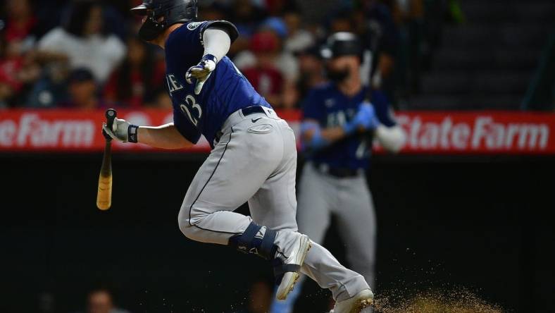 Aug 16, 2022; Anaheim, California, USA; Seattle Mariners first baseman Ty France (23) hits a two run RBI single against the Los Angeles Angels during the sixth inning at Angel Stadium. Mandatory Credit: Gary A. Vasquez-USA TODAY Sports