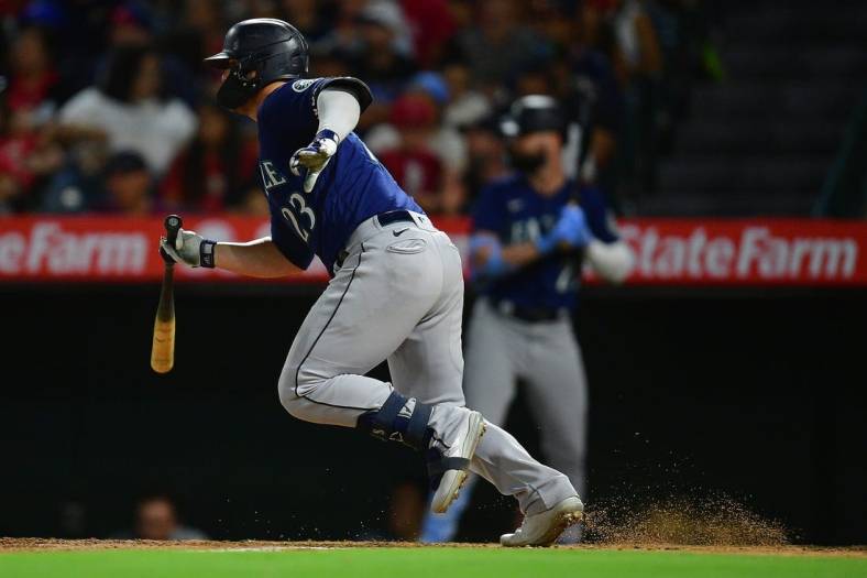 Aug 16, 2022; Anaheim, California, USA; Seattle Mariners first baseman Ty France (23) hits a two run RBI single against the Los Angeles Angels during the sixth inning at Angel Stadium. Mandatory Credit: Gary A. Vasquez-USA TODAY Sports