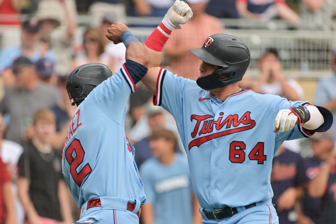 Aug 17, 2022; Minneapolis, Minnesota, USA; Minnesota Twins first baseman Jose Miranda (64) reacts with second baseman Luis Arraez (2) after hitting a home run off Kansas City Royals starting pitcher Daniel Lynch (not pictured) during the first inning at Target Field. Mandatory Credit: Jeffrey Becker-USA TODAY Sports