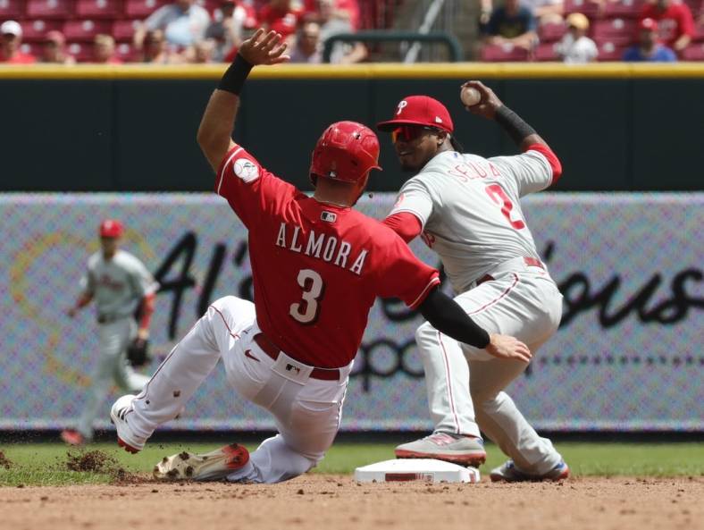 Aug 17, 2022; Cincinnati, Ohio, USA; Cincinnati Reds center fielder Albert Almora Jr. (3) is forced out at second by Philadelphia Phillies second baseman Jean Segura (2) during the second inning at Great American Ball Park. Mandatory Credit: David Kohl-USA TODAY Sports