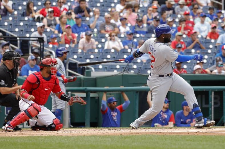 Aug 17, 2022; Washington, District of Columbia, USA; Chicago Cubs designated hitter Franmil Reyes (32) hits a double against the Washington Nationals during the second inning at Nationals Park. Mandatory Credit: Geoff Burke-USA TODAY Sports