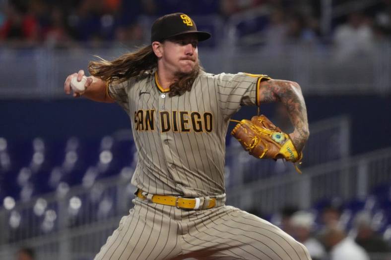 Aug 17, 2022; Miami, Florida, USA; San Diego Padres starting pitcher Mike Clevinger (52) delivers a pitch in the first inning against the Miami Marlins at loanDepot park. Mandatory Credit: Jasen Vinlove-USA TODAY Sports