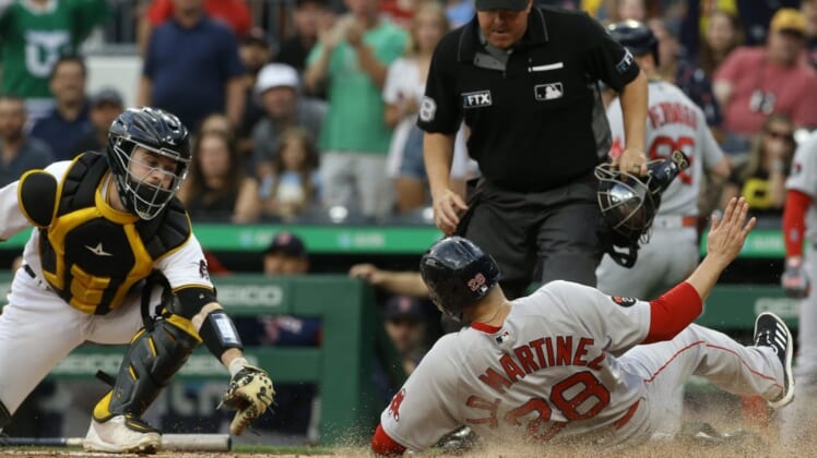 Aug 17, 2022; Pittsburgh, Pennsylvania, USA;  Boston Red Sox designated hitter J.D. Martinez (28) slides into home to score a run as Pittsburgh Pirates catcher Jason Delay (61) attempts a tag during the second inning at PNC Park. Mandatory Credit: Charles LeClaire-USA TODAY Sports