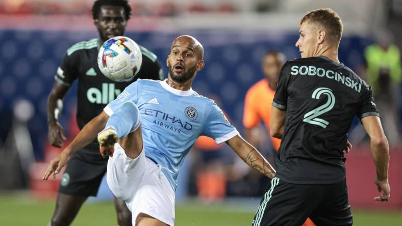 Aug 17, 2022; Harrison, New Jersey, USA; New York City FC forward Heber (9) plays the ball against Charlotte FC defender Jan Sobocinski (2) during the first half at Red Bull Arena. Mandatory Credit: Vincent Carchietta-USA TODAY Sports