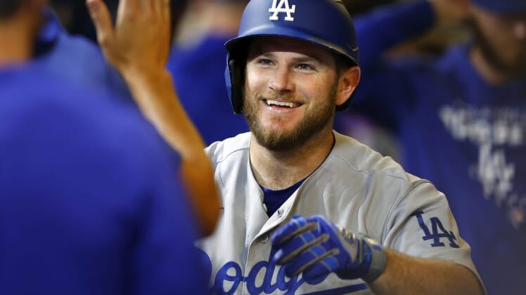 Aug 17, 2022; Milwaukee, Wisconsin, USA;  Los Angeles Dodgers third baseman Max Muncy (13) celebrates after hitting a home run during the seventh inning against the Milwaukee Brewers at American Family Field. Mandatory Credit: Jeff Hanisch-USA TODAY Sports