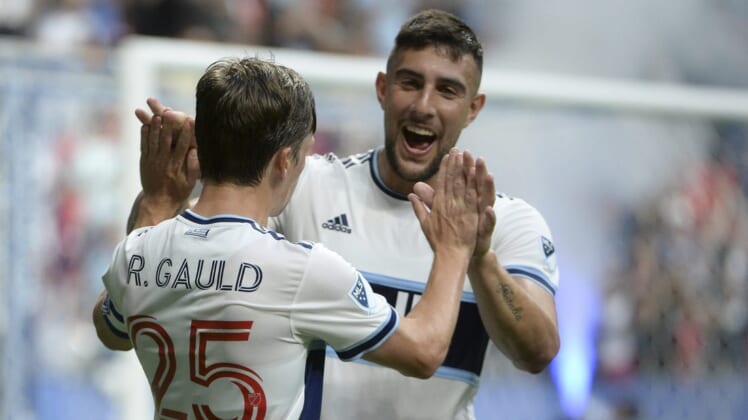 Aug 17, 2022; Vancouver, British Columbia, CAN;  Vancouver Whitecaps FC midfielder Ryan Gauld (25) celebrates his goal with forward Lucas Cavallini (9) after scoring against Colorado Rapids goalkeeper William Yarbrough (22) (not pictured) during the first half at BC Place. Mandatory Credit: Anne-Marie Sorvin-USA TODAY Sports