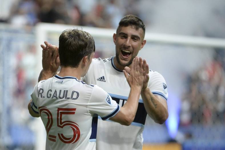 Aug 17, 2022; Vancouver, British Columbia, CAN;  Vancouver Whitecaps FC midfielder Ryan Gauld (25) celebrates his goal with forward Lucas Cavallini (9) after scoring against Colorado Rapids goalkeeper William Yarbrough (22) (not pictured) during the first half at BC Place. Mandatory Credit: Anne-Marie Sorvin-USA TODAY Sports