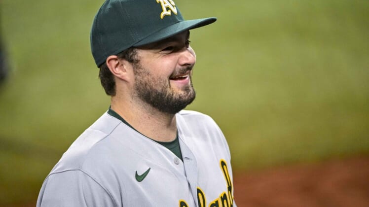 Aug 17, 2022; Arlington, Texas, USA; Oakland Athletics designated hitter Shea Langeliers (23) smiles to the fans after the victory over the Texas Rangers at Globe Life Field. Mandatory Credit: Jerome Miron-USA TODAY Sports