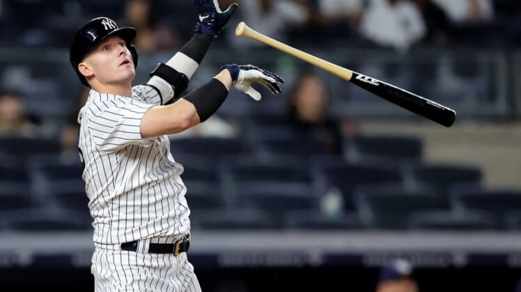Aug 17, 2022; Bronx, New York, USA; New York Yankees designated hitter Josh Donaldson (28) tosses his bat after hitting a game winning grand slam home run against the Tampa Bay Rays during the tenth inning at Yankee Stadium. Mandatory Credit: Brad Penner-USA TODAY Sports