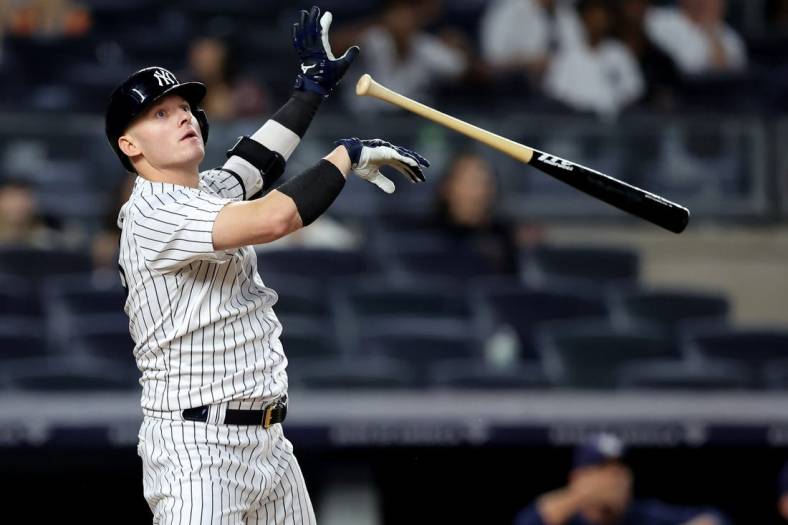Aug 17, 2022; Bronx, New York, USA; New York Yankees designated hitter Josh Donaldson (28) tosses his bat after hitting a game winning grand slam home run against the Tampa Bay Rays during the tenth inning at Yankee Stadium. Mandatory Credit: Brad Penner-USA TODAY Sports