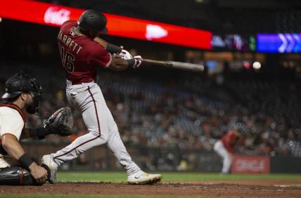 Aug 17, 2022; San Francisco, California, USA; Arizona Diamondbacks left fielder Stone Garrett (46) hits a double during the eighth inning at Oracle Park. Mandatory Credit: D. Ross Cameron-USA TODAY Sports