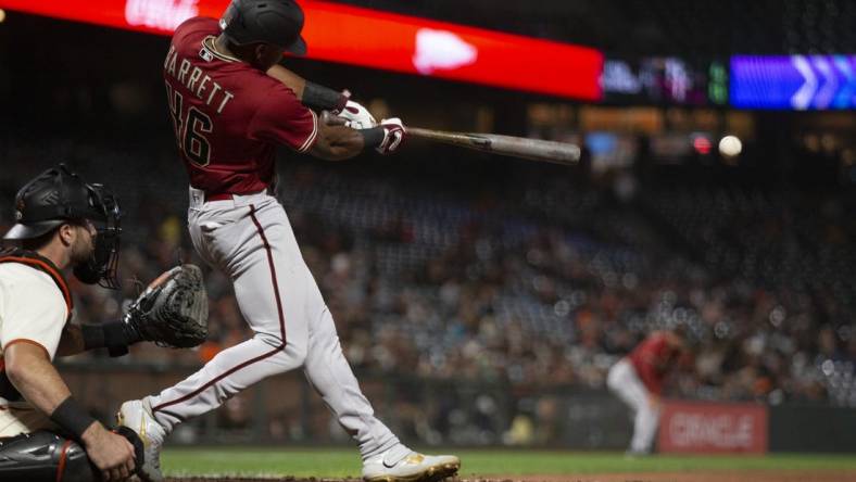 Aug 17, 2022; San Francisco, California, USA; Arizona Diamondbacks left fielder Stone Garrett (46) hits a double during the eighth inning at Oracle Park. Mandatory Credit: D. Ross Cameron-USA TODAY Sports